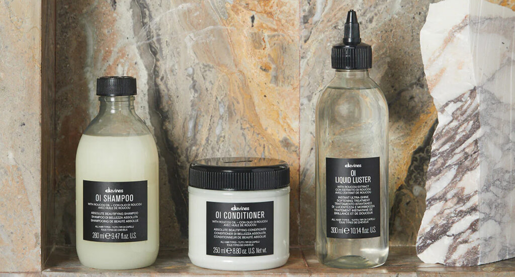Davines OI set with shampoo, conditioner and liquid luster used in Davines sustainable beauty routines.