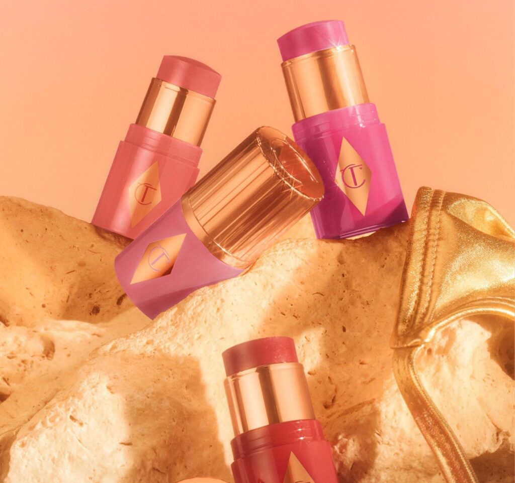 Charlotte Tilbury Mini Unreal Blush Healthy Glow Stick creating a radiant Glow Makeup look.